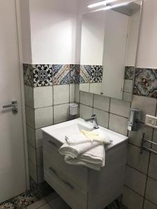 Ванная комната в La Perla Scala dei Turchi