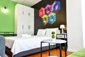 Postel nebo postele na pokoji v ubytování Osten Art Hotel