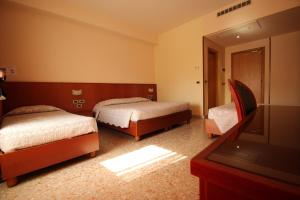 Postel nebo postele na pokoji v ubytování Hotel Oasi Dei Discepoli + 37 fotografií