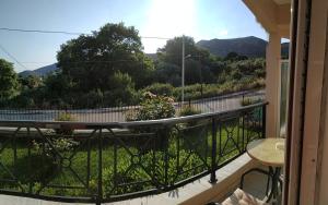 a balcony with a table and a view at Amalia in Paleo Tsifliki
