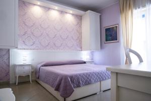 A bed or beds in a room at B&B Brindesi