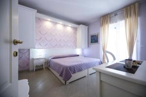 A bed or beds in a room at B&B Brindesi