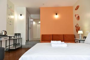 Postel nebo postele na pokoji v ubytování Osten Art Hotel