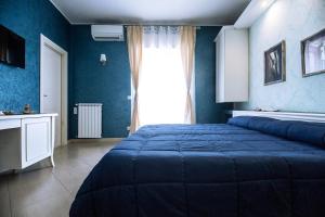 A bed or beds in a room at B&B Brindesi