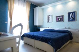 A bed or beds in a room at B&B Brindesi