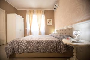 A bed or beds in a room at B&B Brindesi