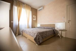 A bed or beds in a room at B&B Brindesi