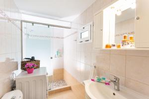 a bathroom with a sink and a toilet at Casa Maritina Gennadi Traditional House in Gennadi +53 photos