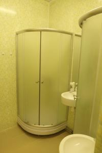 a bathroom with a toilet and a sink at Naktsmītne Elkšņi in Elkšņi