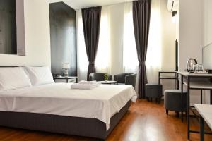 Postel nebo postele na pokoji v ubytování Osten Art Hotel