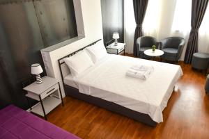Postel nebo postele na pokoji v ubytování Osten Art Hotel