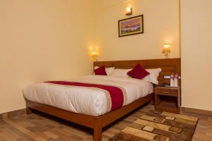 Uma cama ou camas num quarto em Hotel Elegant