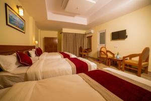 Uma cama ou camas num quarto em Hotel Elegant