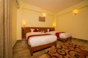Uma cama ou camas num quarto em Hotel Elegant