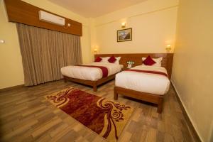 Uma cama ou camas num quarto em Hotel Elegant