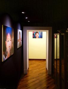 a hallway with pictures on the walls of a room at Il Giardino Segreto in Sorrento