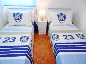 Łóżko lub łóżka w pokoju w obiekcie SAFOR GANDIA - Alquiler solo Familias