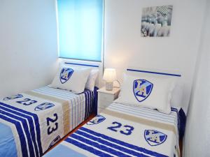 Łóżko lub łóżka w pokoju w obiekcie SAFOR GANDIA - Alquiler solo Familias
