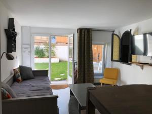 a living room with a couch and a table at Baiona in Bayonne