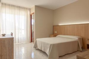 Postel nebo postele na pokoji v ubytování Hotel Turimar