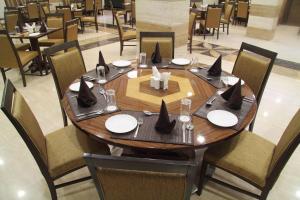 
A restaurant or other place to eat at Amantra Comfort Hotel
