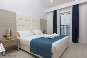 Postel nebo postele na pokoji v ubytování RMH Lopud Lafodia Resort & Wellness