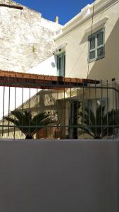 a house with a fence in front of it at Yalitzi in Symi