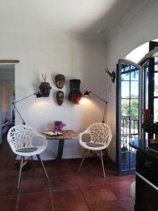 a dining room with a table and two chairs at Casa MariSol in Arcos de la Frontera +21 photos