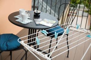 a small table and chairs on a balcony at Affittacamere da Sabri in Numana