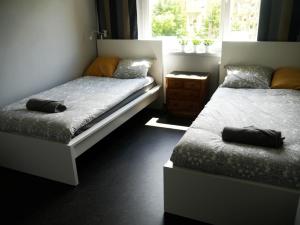 Un pat sau paturi într-o cameră la Apartament Unikat