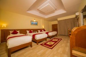 Uma cama ou camas num quarto em Hotel Elegant