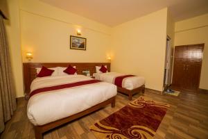 Uma cama ou camas num quarto em Hotel Elegant