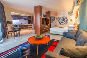a living room with a couch and a table at Shoshana Hotel Boutique in Buenos Aires