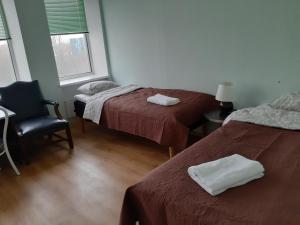 Postel nebo postele na pokoji v ubytování Majaka Hostel