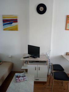 a small room with a desk with a computer on it at U Žaludů in Ledenice