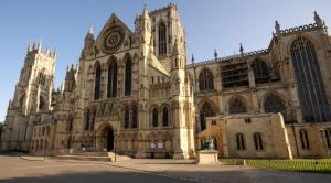 a large stone building with a cathedral at Grange Lodge in York +26 photos