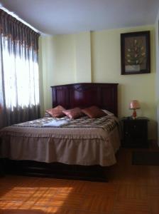 Postel nebo postele na pokoji v ubytování Hostal Jora Continental