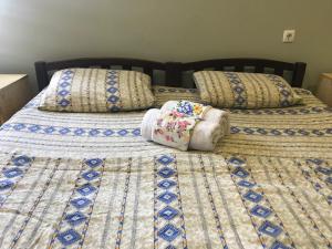 Postel nebo postele na pokoji v ubytování Mimino Guest House