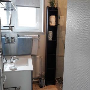 a bathroom with a sink and a window at L'HORIZON Vue mer et falaises in Fécamp +38 photos