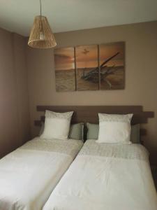 En eller flere senge i et værelse på framboise