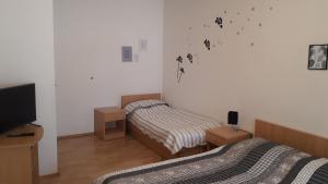 Postel nebo postele na pokoji v ubytování Apartmani Riba