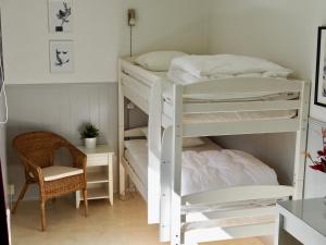 A bed or beds in a room at Orsastuguthyrning-Born