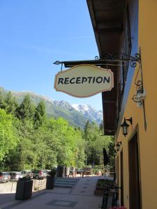 a sign for a restaurant on the side of a building at Chalet Presanella in Temù