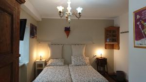 Postel nebo postele na pokoji v ubytování B&B Maison Odille