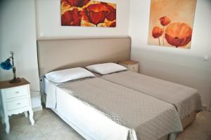 Postel nebo postele na pokoji v ubytování Chalkida Apartments