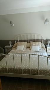 a bed in a bedroom with two pillows on it at B&B La Boissière Et Le Vialat in Montagnac