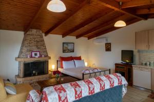 a bedroom with a bed and a fireplace at Rose's House (Near Airport) in Artemida