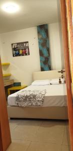 a bedroom with a bed and a mirror at Marina's Rooms in Larnaca