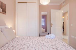 Posteľ alebo postele v izbe v ubytovaní Beach and golf apartament