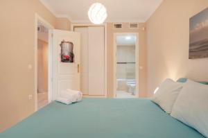 Posteľ alebo postele v izbe v ubytovaní Beach and golf apartament